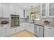 Well-equipped kitchen features granite countertops, stainless steel appliances, and updated cabinetry at 1099 Nokomis S Ave, Venice, FL 34285