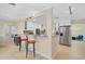 Modern kitchen boasts white cabinetry, granite countertops, and stainless steel appliances for a clean, functional space at 1099 Nokomis S Ave, Venice, FL 34285