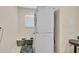 Cozy laundry room features a stacked washer and dryer, plus storage at 1099 Nokomis S Ave, Venice, FL 34285