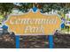 Centennial Park sign surrounded by trees, inviting visitors to enjoy the green space at 1099 Nokomis S Ave, Venice, FL 34285