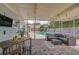 Relaxing screened-in patio with comfortable seating and view of the refreshing pool at 1099 Nokomis S Ave, Venice, FL 34285