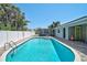 Inviting backyard pool with ample space for relaxing and enjoying the outdoors at 1099 Nokomis S Ave, Venice, FL 34285