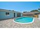 Well maintained pool surrounded by brick pavers, offering a private backyard retreat at 1099 Nokomis S Ave, Venice, FL 34285