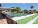 Well-maintained shuffleboard courts with covered seating, perfect for friendly competition and outdoor recreation at 1099 Nokomis S Ave, Venice, FL 34285