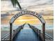 Venice Fishing Pier archway against a beautiful sunset, inviting visitors to enjoy the ocean view at 1099 Nokomis S Ave, Venice, FL 34285