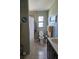 Bathroom with a shower, toilet, sink, and decorative accents, designed for functionality and personal care at 1103 Lucille Ave, Nokomis, FL 34275
