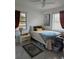 Sunlit bedroom features a soft bed and plenty of natural light at 1103 Lucille Ave, Nokomis, FL 34275