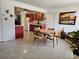 Sunlit dining area adjacent to kitchen with charming decor and seating for four at 1103 Lucille Ave, Nokomis, FL 34275