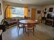 Charming dining space with retro furnishings, bright window and vintage decor at 1103 Lucille Ave, Nokomis, FL 34275