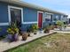 Charming single-story home with a well-maintained front yard and a vibrant blue exterior at 1103 Lucille Ave, Nokomis, FL 34275