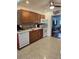 Functional kitchen with essential appliances and views into the dining room at 1103 Lucille Ave, Nokomis, FL 34275