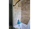 Close up of tiled walk-in shower with rainfall showerhead at 1103 Lucille Ave, Nokomis, FL 34275