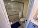 Bathroom featuring a glass-enclosed shower, toilet, and vanity at 1154 Bird Bay Way # 303, Venice, FL 34285