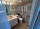 Bathroom with a vanity, toilet, and shower with a patterned curtain at 1154 Bird Bay Way # 303, Venice, FL 34285