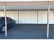Carport with dedicated parking spaces at 1154 Bird Bay Way # 303, Venice, FL 34285
