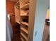 Spacious walk-in closet with ample shelving for organization and storage at 1154 Bird Bay Way # 303, Venice, FL 34285