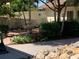 Charming courtyard with a tiered fountain, lush greenery, and inviting benches at 1154 Bird Bay Way # 303, Venice, FL 34285