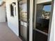 Condo entrance featuring a secure screen door and unit number at 1154 Bird Bay Way # 303, Venice, FL 34285
