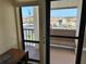 Exterior view from a condo featuring a balcony with sliding glass doors at 1154 Bird Bay Way # 303, Venice, FL 34285