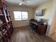 Bright office space with a built-in bookcase, desk, and a window with a view at 1154 Bird Bay Way # 303, Venice, FL 34285