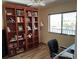 Home office with built-in bookcase, desk, and a window with natural light at 1154 Bird Bay Way # 303, Venice, FL 34285