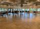 Large meeting room with elegant light fixtures and expansive windows at 1154 Bird Bay Way # 303, Venice, FL 34285