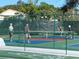 Active pickleball players in the community on a sunny day, with lush green landscaping at 1154 Bird Bay Way # 303, Venice, FL 34285