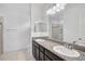 Bathroom with double sinks, granite countertops, and a walk-in shower at 12014 Creek Preserve Dr, Riverview, FL 33579