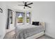 Cozy bedroom featuring a comfortable bed and three windows letting in natural light at 12014 Creek Preserve Dr, Riverview, FL 33579