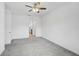 Spacious bedroom with carpet, fan and view to the en-suite bathroom at 12014 Creek Preserve Dr, Riverview, FL 33579