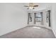 Sunlit bedroom featuring plush carpeting, neutral walls, and multiple windows at 12014 Creek Preserve Dr, Riverview, FL 33579
