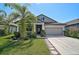 Charming single-Gathering home with a well-manicured lawn and professional landscaping at 12014 Creek Preserve Dr, Riverview, FL 33579