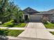 Charming single-Gathering home features a two-car garage and lush landscaping at 12014 Creek Preserve Dr, Riverview, FL 33579