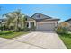 Charming single-Gathering home featuring an attached garage and professional landscaping at 12014 Creek Preserve Dr, Riverview, FL 33579