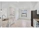 Bright and open kitchen with stainless steel appliances, granite countertops, and ample cabinet space at 12014 Creek Preserve Dr, Riverview, FL 33579