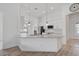 Stylish kitchen island with granite countertop, pendant lighting, and views into the living area at 12014 Creek Preserve Dr, Riverview, FL 33579