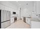 Contemporary kitchen with stainless steel appliances, white cabinetry, and an open layout for easy entertaining at 12014 Creek Preserve Dr, Riverview, FL 33579