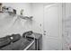 Practical laundry room with shelving and modern washer and dryer units at 12014 Creek Preserve Dr, Riverview, FL 33579