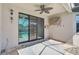 Covered patio with ceiling fan, outdoor TV, and view of the screened-in pool at 12014 Creek Preserve Dr, Riverview, FL 33579