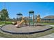 Community playground with climbing structure, slides, and green surroundings at 12014 Creek Preserve Dr, Riverview, FL 33579