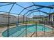 Screened pool with a safety fence and outdoor lighting at 12014 Creek Preserve Dr, Riverview, FL 33579