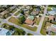 An aerial view highlighting a home with a swimming pool in a residential neighborhood at 1203 Hudson Rd, Venice, FL 34293