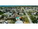Aerial view of the property showcasing a community with mature trees and private pools at 1203 Hudson Rd, Venice, FL 34293