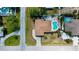 Aerial view of a single-Gathering home with a private pool and well-maintained landscaping at 1203 Hudson Rd, Venice, FL 34293