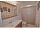 Bright bathroom with a single sink vanity, mirrored medicine cabinet, and a shower-tub combo at 1203 Hudson Rd, Venice, FL 34293