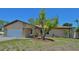 A charming single-story house featuring stone accents and a well-manicured front yard at 1203 Hudson Rd, Venice, FL 34293