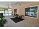 Covered lanai with table and chairs and view of the swimming pool at 1203 Hudson Rd, Venice, FL 34293