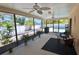 Screened lanai with view of the pool and backyard at 1203 Hudson Rd, Venice, FL 34293