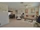 Open-concept living room and dining area with tile flooring and lots of natural light at 1203 Hudson Rd, Venice, FL 34293