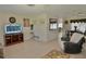 Cozy open-concept living room and dining area featuring tile flooring and multiple ceiling fans at 1203 Hudson Rd, Venice, FL 34293